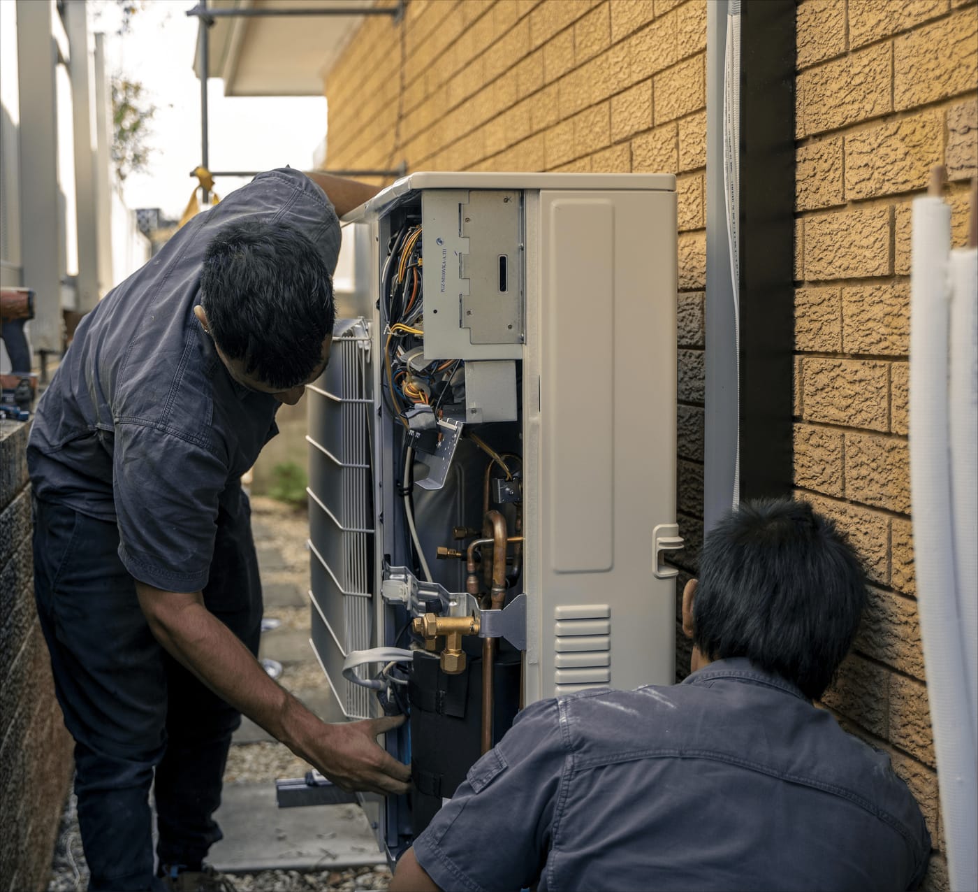 Tormey's technicians servicing an outdoor unit